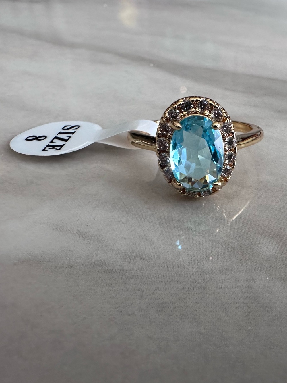 Blue Topaz Oval Halo Cocktail Ring - Gold Tone